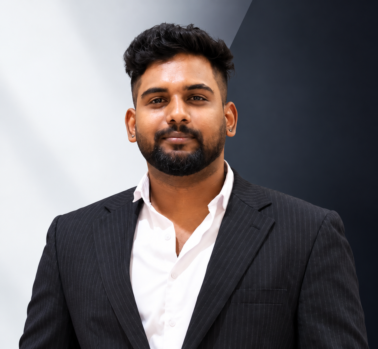 Portrait of Akhil Raj R C in a dark pinstripe blazer